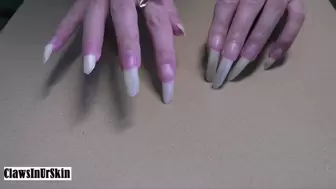 hard scratching and piercing the cardboard with my nails