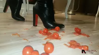 High heels boots crushig cherry tomatoes
