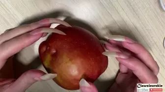 Nails scratching, piercing and clawing apple