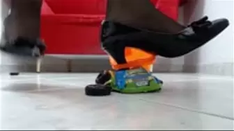 crushing a toycar in black stiletto heels with toes spreading