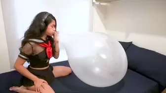 Asian School Blow to Pops a Large Balloon