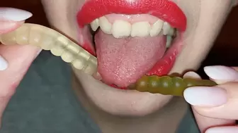 Licking coloured gummy worms