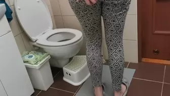 Sexy leggings on long shaved legs in toilet adventures