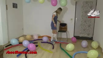 Girl in blue platform Chucks on balloons in 4K (0275)