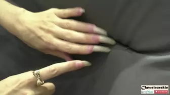 nails scratching a leather chair