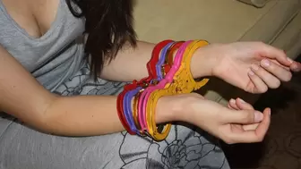 Angelica - Locking 5 Pairs of Color Handcuffs On (Mpeg)