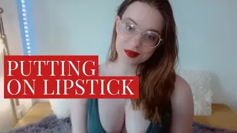 Applying red lipstick on my big lips