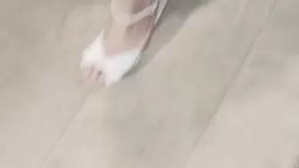 Walking in kitchen in white heels