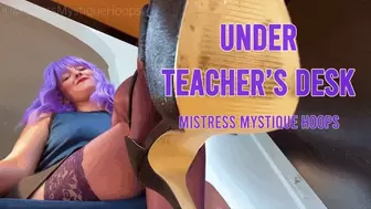 Under Teacher's Desk