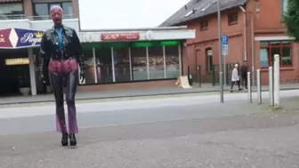 Pierced Latex Girl in Transparent Jeans, Stockings, Blouse, Jacket, Demask Corsett Mask and Gloves walks in the town with piercings rings hanging out & Butt Plug Part III