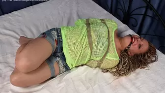 Judith: ballgagged barefoot girl, hogtied in yellow top and jeans shorts, is trying to make her position easier (HD MP4)