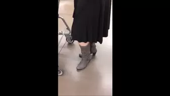 Black Friday Shopping in Black Skirt, Bare Legs & Gray Boots a
