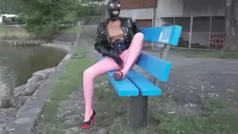 Pierced Latex Girl in Pink Leggings, Blouse, Jacket, Demask Corsett & Mask Gloves walks in the city with piercings rings hanging out & Masturbating Rubber Dildo PART II