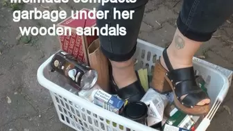 Iffelmaus compacts garbage under her wooden sandals