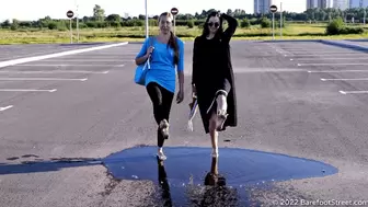 Anastasia and Kristina with huge feet barefoot on an asphalt field (Part 3 of 4) #20220420