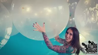 Megan pops a lot of 40 Inch Boom Balloons with her Fingernails in the Pool HD Version