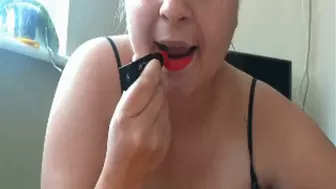 Sucking on a dildo with red lipstick b