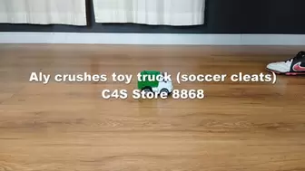 Aly crushes toy truck (soccer cleats)
