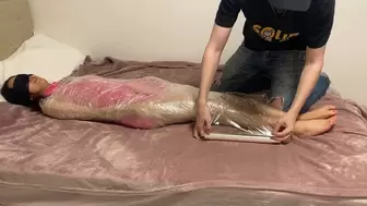 Taylor Gets Mummified in Plastic Wrap