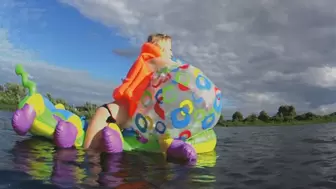 Alla rides a big rare inflatable caterpillar on the lake and blows away a big rare beach ball!!!