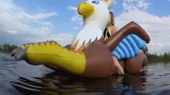 Alla rides a huge inflatable griffin on the lake and fucks him hotly and gets an orgasm!!!