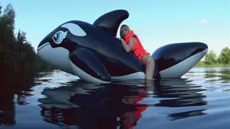 Alla hotly fucks a big inflatable black whale on the lake and wears an inflatable vest for safety!!!
