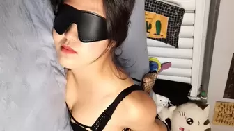 Blindfolded bitch tied hands and feet on bed