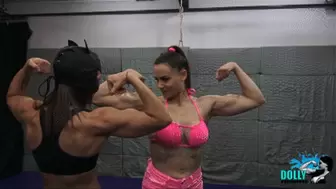 Dolly lift and carries Kim, muscular ladies flexing together