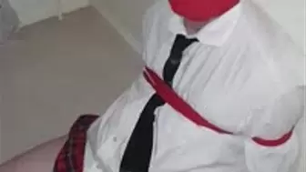 Man tied up in adult schoolgirl uniform 2