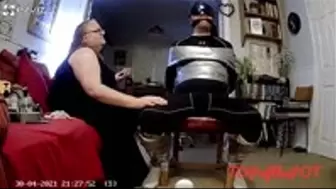 Man being duct taped to chair