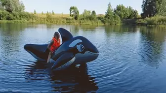 Alla rides a huge inflatable whale on the lake and fucks him hotly getting a real orgasm!!!