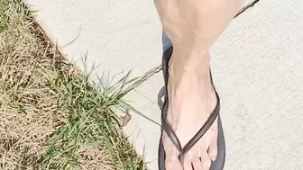 Tempest in flip flops showing off bare toes
