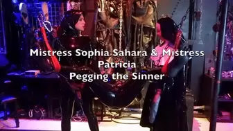 Mistress Sophia Sahara & Mistress Patricia Pegging the Sinner