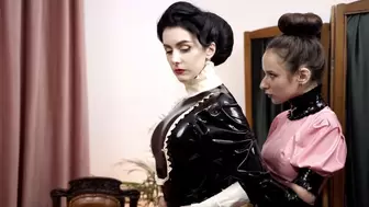 Latex maid puts latex on her Mistress