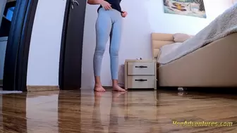 Desperate girl pissing in her tights while cleaning the house