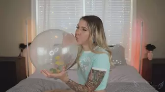 Angel blows up confetti balloons