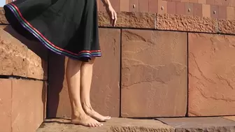 Barefoot on red stone