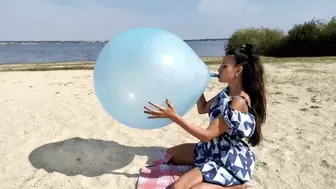 The blue balloon will explode into shreds on Darina's lips