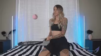Sporty girl blows up balloons