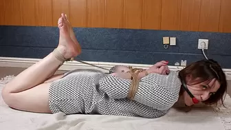 Ballgagged barefoot Gladys, hogtied with her hands tied in reverse prayer position, is getting her feet creamed abd tickled by her friend (HD MP4)
