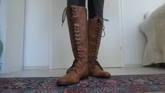 Brown lace-up boots show