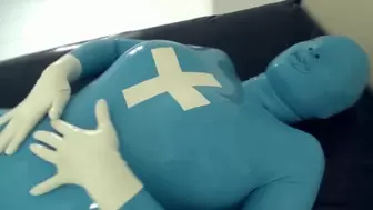 Patient In Blue Latex Catsuit With Condom Mask Bondaged And Fucked Hard