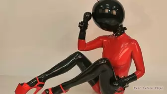 Red rubber girl puts latex lingerie and inflatable rubber ball-hood