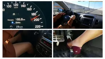 Sexy girl drives car very fast on the highway