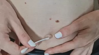 Alanna cleans her belly button