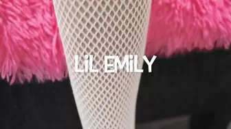 Lil Emily Benjamins wears red high heels and fish nets