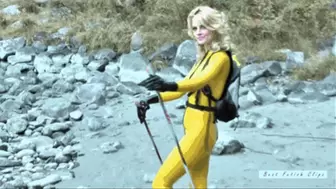 Blonde girl in yellow latex catsuit hiking