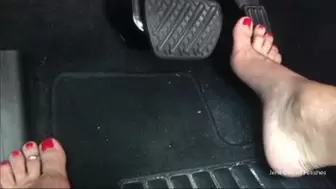 Driving with red toenails floor view_