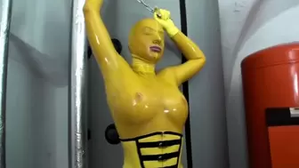 Girl in yellow latex catsuit and fishnets - Self bondaged