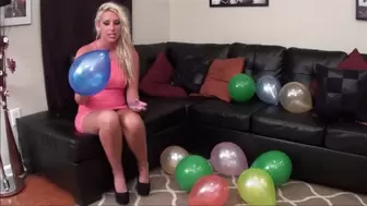 Sexy blonde sits on her balloons!